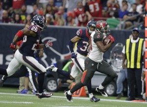 Tampa Bay Buccaneers running back Charles Sims (34) makes a run against the Houston Texans during the first half of an NFL football game Sunday, Sept. 27, 2015, in Houston. (AP Photo/Patric Schneider)