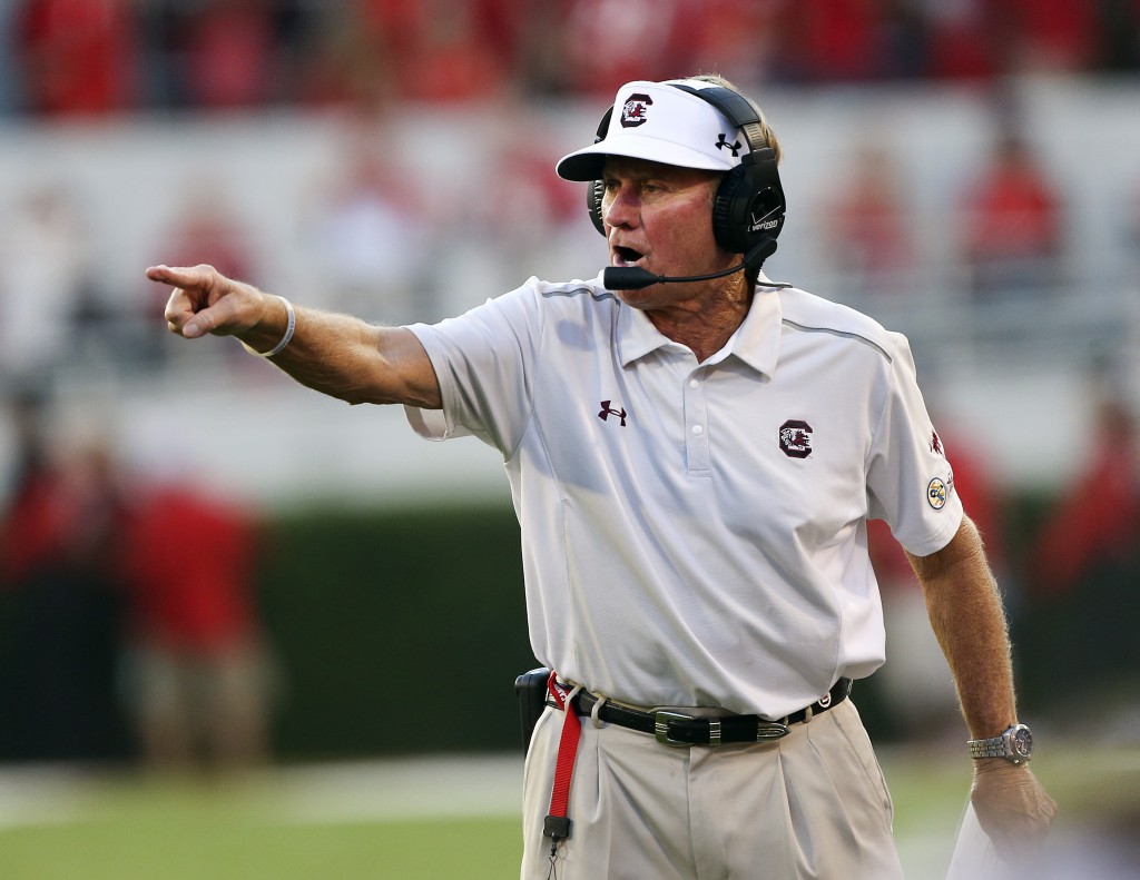 South Carolina coach Steve Spurrier motions to his team from the sideline during the first half of an NCAA college football game against Georgia on Saturday, Sept. 19, 2015, in Athens, Ga. (AP Photo/John Bazemore)
