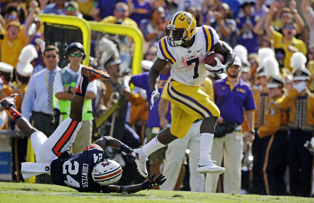 LSU running back Leonard Fournette (7) eludes Auburn defensive back Blake Countess (24) on a 40 hard touchdown run in the first half of an NCAA college football game in Baton Rouge, La., Saturday, Sept. 19, 2015. (AP Photo/Gerald Herbert)