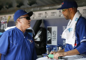 Toronto Blue Jays manager John Gibbons, left, talks with starting pitcher David Price, right, in the dugout during a baseball game against the Texas Rangers Thursday, Aug. 27, 2015, in Arlington, Texas. (AP Photo/Tony Gutierrez)
