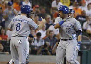 Kansas City Royals' Salvador Perez (13) celebrates with teammate Mike Moustakas, right, after hitting a two-run home run against the Houston Astros in the second inning during Game 4 of baseball's American League Division Series Monday, Oct. 12, 2015, in Houston. (AP Photo/Pat Sullivan)