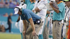 FILE - In this Sept. 27, 2015, file photo, Miami Dolphins head coach Joe Philbin looks down during the second half of an NFL football game against the Buffalo Bills in Miami Gardens, Fla. Philbin was fired Monday, Oct. 5, 2015, four games into his fourth season as coach of the Dolphins, and one day after a flop on an international stage that apparently sealed his fate. (AP Photo/Wilfredo Lee, File)