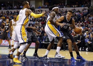 Nov 9, 2015; Indianapolis, IN, USA; Orlando Magic forward Aaron Gordon (00) drives baseline against Indiana Pacers center Jordan Hill (27) and guard Monta Ellis (11) at Bankers Life Fieldhouse. Mandatory Credit: Brian Spurlock-USA TODAY Sports