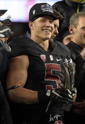Dec 5, 2015; Santa Clara, CA, USA; Stanford Cardinal running back Christian McCaffrey (5) holds the most valuable player trophy after the Pac-12 Conference football championship game against the Southern California Trojans at Levi's Stadium. Stanford defeated USC 41-22. Mandatory Credit: Kirby Lee-USA TODAY Sports