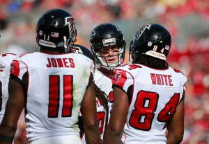 Atlanta Falcons quarterback Matt Ryan (2) talks with wide receiver Julio Jones (11) and wide receiver Roddy White (84) against the Tampa Bay Buccaneers during the first quarter at Raymond James Stadium. Mandatory Credit: Kim Klement-USA TODAY Sports