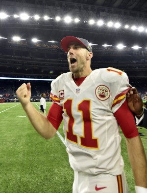 Jan 9, 2016; Houston, TX, USA; Kansas City Chiefs quarterback Alex Smith (11) celebrates as he runs off the field following the Chiefs 30-0 victory against the Houston Texans in the AFC Wild Card playoff football game at NRG Stadium . Mandatory Credit: John David Mercer-USA TODAY Sports