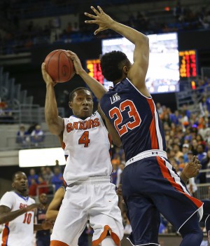 Jan 23, 2016; Gainesville, FL, USA; Florida Gators guard KeVaughn Allen (4) shoots over Auburn Tigers guard TJ Lang (23) during the second half of a basketball game at Stephen C. O'Connell Center. The Gators won 95-63. Mandatory Credit: Reinhold Matay-USA TODAY Sports