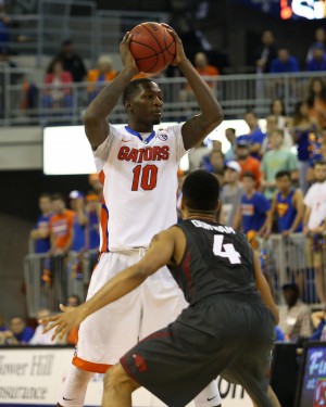 Feb 3, 2016; Gainesville, FL, USA; Florida Gators forward Dorian Finney-Smith (10) looks to pass the ball as Arkansas Razorbacks guard Jabril Durham (4) defends in the second half at Stephen C. O'Connell Center. The Florida Gators won 87-83. Mandatory Credit: Logan Bowles-USA TODAY Sports