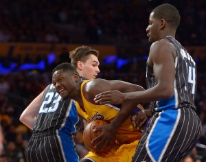 Mar 8, 2016; Los Angeles, CA, USA; Orlando Magic forward Jason Smith (14) and guard C.J. Watson (32) defend Los Angeles Lakers forward Julius Randle (30) in the second half of the game at Staples Center. The Lakers won 107-98. Mandatory Credit: Jayne Kamin-Oncea-USA TODAY Sports