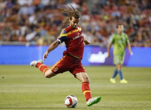 Aug 22, 2015; Sandy, UT, USA; Real Salt Lake midfielder Kyle Beckerman (5) shoots the ball against the Seattle Sounders FC in the first half at Rio Tinto Stadium. Mandatory Credit: Jeff Swinger-USA TODAY Sports