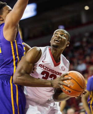 Feb 23, 2016; Fayetteville, AR, USA; Arkansas Razorbacks forward Moses Kingsley (33) looks to the basket while being guarded by LSU Tigers forward Craig Victor II (32) in the first half at Bud Walton Arena. Mandatory Credit: Gunnar Rathbun-USA TODAY Sports