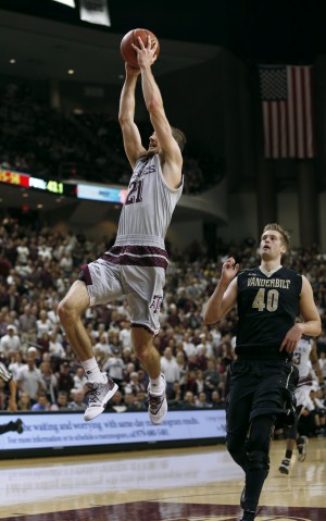 Mar 5, 2016; College Station, TX, USA; Texas A&M Aggies guard Alex Caruso (21) goes up for a slam dunk against Vanderbilt Commodores center Josh Henderson (40) at Reed Arena. A&M won 76-67 and the SEC Championship with the victory. Mandatory Credit: Erich Schlegel-USA TODAY Sports