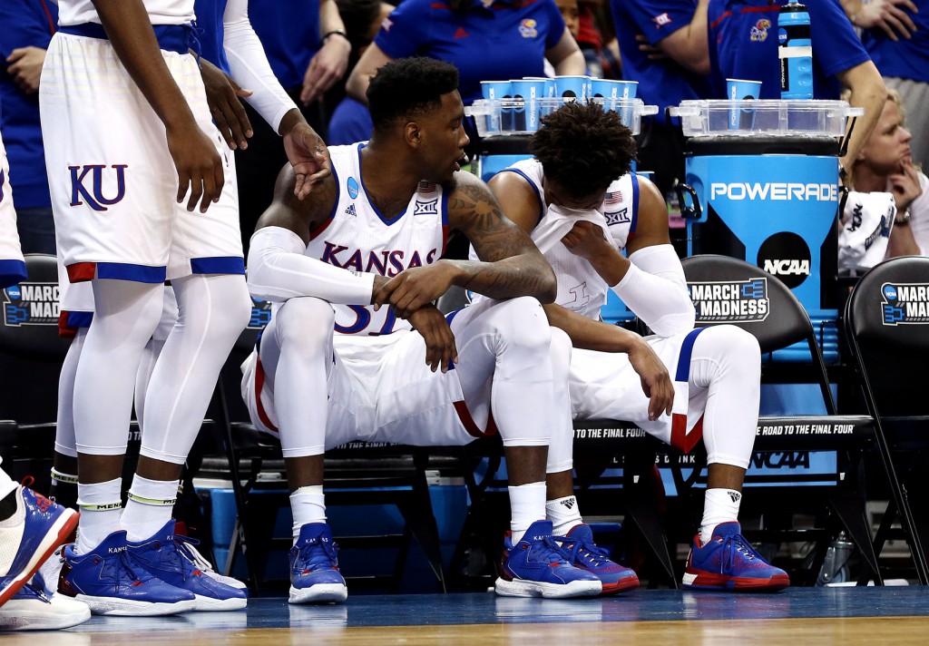 Mar 26, 2016; Louisville, KY, USA; Kansas Jayhawks guard Devonte' Graham (4) reacts on the bench during the second half against the Villanova Wildcats in the south regional final of the NCAA Tournament at KFC YUM!. Mandatory Credit: Aaron Doster-USA TODAY Sports