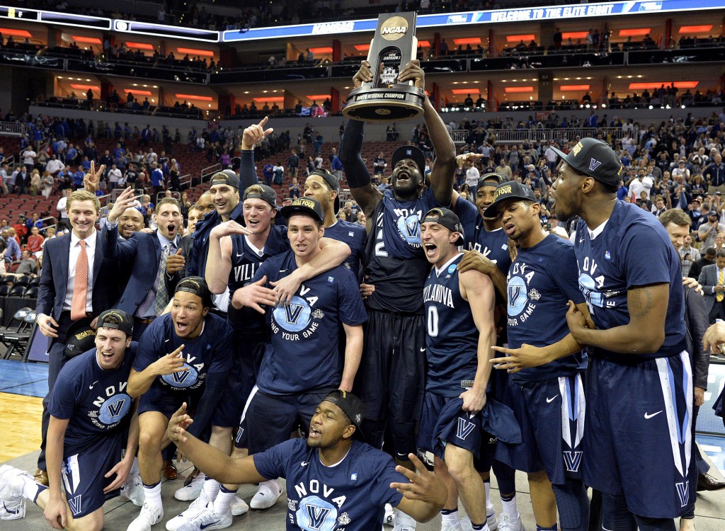 Mar 26, 2016; Louisville, KY, USA; The Villanova Wildcats celebrates after beating the Kansas Jayhawks in the south regional final of the NCAA Tournament at KFC YUM!. Mandatory Credit: Jamie Rhodes-USA TODAY Sports