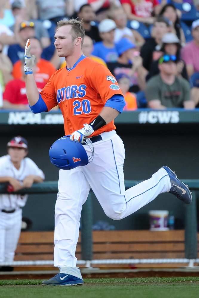 un 20, 2015; Omaha, NE, USA; Florida Gators infielder Peter Alonso (20) signals his team after hitting a home run in the second inning against the Virginia Cavaliers in the 2015 College World Series at TD Ameritrade Park. Mandatory Credit: Steven Branscombe-USA TODAY Sports