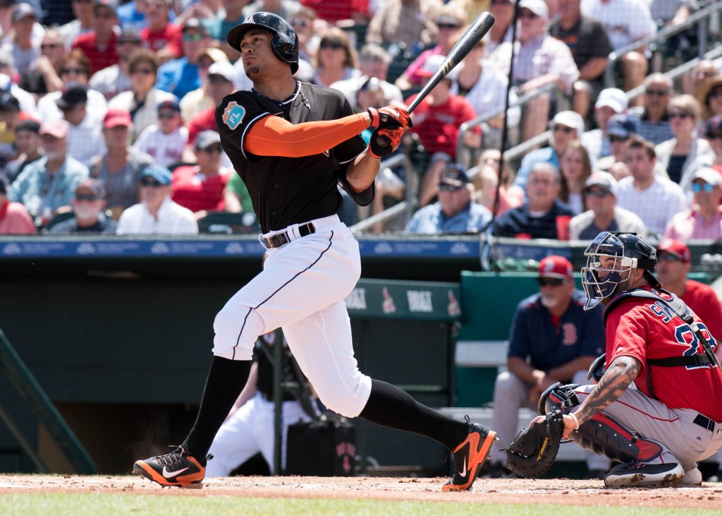 Mar 22, 2016; Jupiter, FL, USA; Miami Marlins right fielder Giancarlo Stanton (27) at bat against the Boston Red Sox during a spring training game at Roger Dean Stadium. Mandatory Credit: Steve Mitchell-USA TODAY Sports