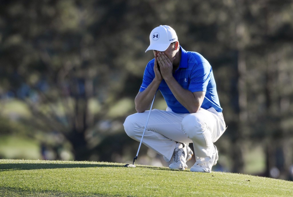 Apr 10, 2016; Augusta, GA, USA; Jordan Spieth reacts as he waits to putt on the 18th green during the final round of the 2016 The Masters golf tournament at Augusta National Golf Club. Mandatory Credit: Michael Madrid-USA TODAY Sports