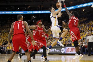 Apr 18, 2016; Oakland, CA, USA; Golden State Warriors guard Klay Thompson (11) attempts a shot over Houston Rockets guard Patrick Beverley (2) in the fourth quarter in game two of the first round of the NBA Playoffs at Oracle Arena. The Warriors defeated the Rockets 115-106. Mandatory Credit: Cary Edmondson-USA TODAY Sports