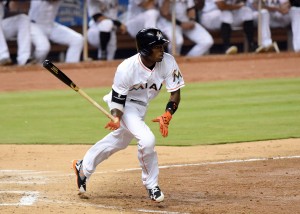 Apr 5, 2016; Miami, FL, USA; Miami Marlins second baseman Dee Gordon (9) connects for a triple during the sixth inning against the Detroit Tigers at Marlins Park. Mandatory Credit: Steve Mitchell-USA TODAY Sports