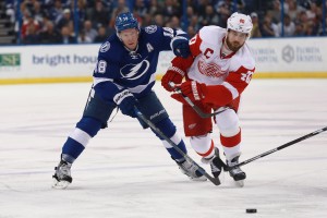 Mar 22, 2016; Tampa, FL, USA; Tampa Bay Lightning left wing Ondrej Palat (18) and Detroit Red Wings left wing Henrik Zetterberg (40) fight to control the puck during the first period at Amalie Arena. Mandatory Credit: Kim Klement-USA TODAY Sports