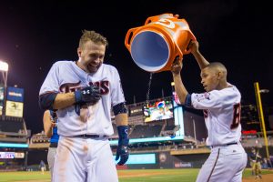 Jun 7, 2016; Minneapolis, MN, USA; Minnesota Twins bat boy Dominic Frost dumps gatorade on second baseman Brian Dozier (2) after his walk off home run in the eleventh inning against the Miami Marlins at Target Field. The Minnesota Twins beat the Miami Marlins 6-4 in 11 innings. Mandatory Credit: Brad Rempel-USA TODAY Sports