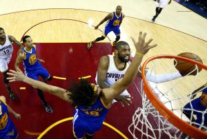Jun 8, 2016; Cleveland, OH, USA; Cleveland Cavaliers guard Kyrie Irving (2) shoots the ball against Golden State Warriors forward Anderson Varejao (18) in game three of the NBA Finals at Quicken Loans Arena. Mandatory Credit: Ronald Martinez/Pool Photo via USA TODAY Sports