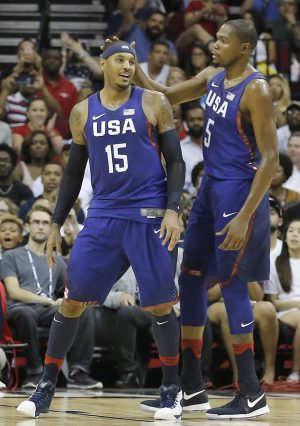 Aug 1, 2016; Houston, TX, USA; United States guard Kevin Durant (5) congratulates forward Carmelo Anthony (15) after making a basket against Nigeria in the second quarter during an exhibition basketball game between United States and Nigeria at Toyota Center. Mandatory Credit: Thomas B. Shea-USA TODAY Sports