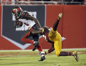Aug 31, 2016; Tampa, FL, USA; Washington Redskins defensive back Mariel Cooper (32) can't keep Tampa Bay Buccaneers wide receiver Bernard Reedy (15) from scoring on a pass play during the second half of a football game at Raymond James Stadium. The Redskins won 20-13. Mandatory Credit: Reinhold Matay-USA TODAY Sports