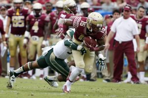 Sep 12, 2015; Tallahassee, FL, USA; Florida State Seminoles wide receiver Travis Rudolph (15) picks up a first down against the South Florida Bulls at Doak Campbell Stadium. Florida State won 34-14. Mandatory Credit: Glenn Beil-USA TODAY Sports