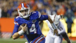 Sep 3, 2016; Gainesville, FL, USA; Florida Gators quarterback Luke Del Rio (14) keeps the ball and runs during the first quarter of a football game against the Massachusetts Minutemen at Ben Hill Griffin Stadium. Mandatory Credit: Reinhold Matay-USA TODAY Sports