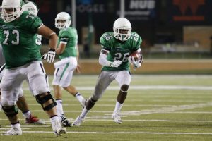 Sep 3, 2016; Denton, TX, USA; North Texas Mean Green running back Jeffrey Wilson (26) rushes against the Southern Methodist Mustangs in the fourth quarter at Apogee Stadium. Mandatory Credit: Sean Pokorny-USA TODAY Sports