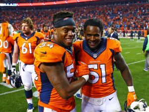Sep 8, 2016; Denver, CO, USA; Denver Broncos linebacker Brandon Marshall (54) celebrates with linebacker Todd Davis (51) following the game against the Carolina Panthers at Sports Authority Field at Mile High. The Broncos defeated the Panthers 21-20. Mandatory Credit: Mark J. Rebilas-USA TODAY Sports