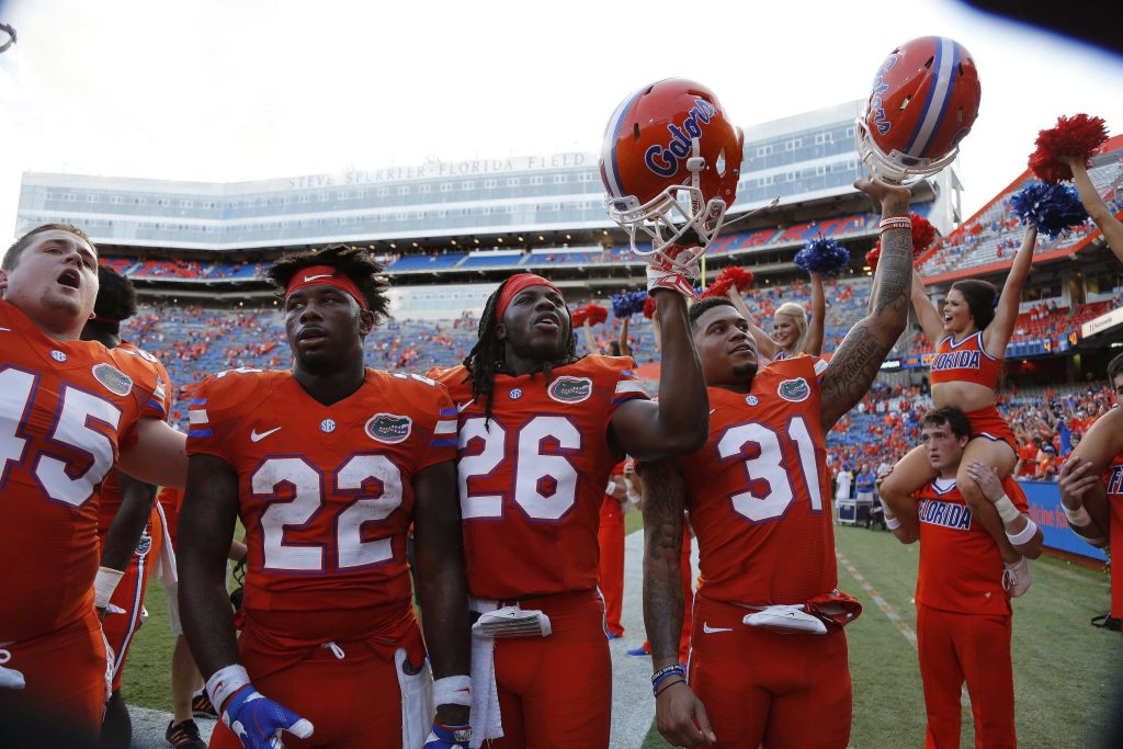 Sep 10, 2016; Gainesville, FL, USA; Florida Gators defensive back Teez Tabor (31), defensive back Marcell Harris (26), running back Lamical Perine (22) clearer after they beat the Kentucky Wildcats. Gators defeated the Kentucky Wildcats 45-7. Mandatory Credit: Kim Klement-USA TODAY Sports