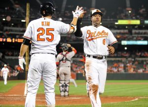 Sep 21, 2016; Baltimore, MD, USA; Baltimore Orioles second baseman Jonathan Schoop (6) celebrates with outfielder Hyun Soo Kim (25) after scoring a run in the third inning against the Boston Red Sox at Oriole Park at Camden Yards. Mandatory Credit: Evan Habeeb-USA TODAY Sports