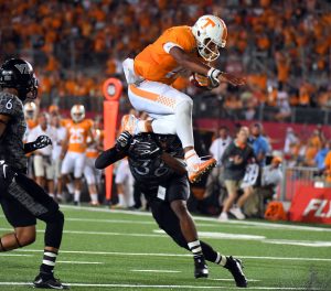 Sep 10, 2016; Bristol, TN, USA; Tennessee Volunteers quarterback Joshua Dobbs (11) runs for a touchdown during the second half against the Virginia Tech Hokies at Bristol Motor Speedway. Tennessee won 45-24. Mandatory Credit: Christopher Hanewinckel-USA TODAY Sports