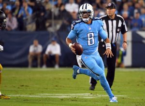 Oct 27, 2016; Nashville, TN, USA; Tennessee Titans quarterback Marcus Mariota (8) runs for a first down in the first half against the Jacksonville Jaguars at Nissan Stadium. Mandatory Credit: Christopher Hanewinckel-USA TODAY Sports