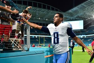 Sep 1, 2016; Miami Gardens, FL, USA; Tennessee Titans quarterback Marcus Mariota (8) hands a fan his baseball cap as he leaves the field after defeating the Miami Dolphins 21-10 at Hard Rock Stadium. Mandatory Credit: Steve Mitchell-USA TODAY Sports