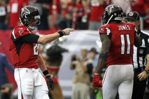 Oct 2, 2016; Atlanta, GA, USA; Atlanta Falcons wide receiver Julio Jones (11) celebrates his touchdown catch with quarterback Matt Ryan (2) in the fourth quarter of their game against the Carolina Panthers at the Georgia Dome. The Falcons won 48-33. Mandatory Credit: Jason Getz-USA TODAY Sports