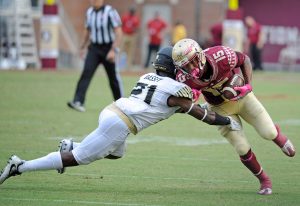 Oct 15, 2016; Tallahassee, FL, USA; Florida State Seminoles wide receiver Travis Rudolph (15) is tackled by Wake Forest Demon Deacons cornerback Essang Bassey (21) during the game at Doak Campbell Stadium. Mandatory Credit: Melina Vastola-USA TODAY Sports