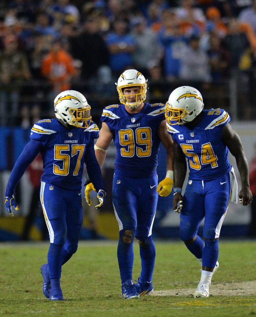 Oct 13, 2016; San Diego, CA, USA; San Diego Chargers defensive end Joey Bosa (99) inside linebacker Jatavis Brown (57) and outside linebacker Melvin Ingram (54) celebrate during the fourth quarter against the Denver Broncos at Qualcomm Stadium. Mandatory Credit: Jake Roth-USA TODAY Sports