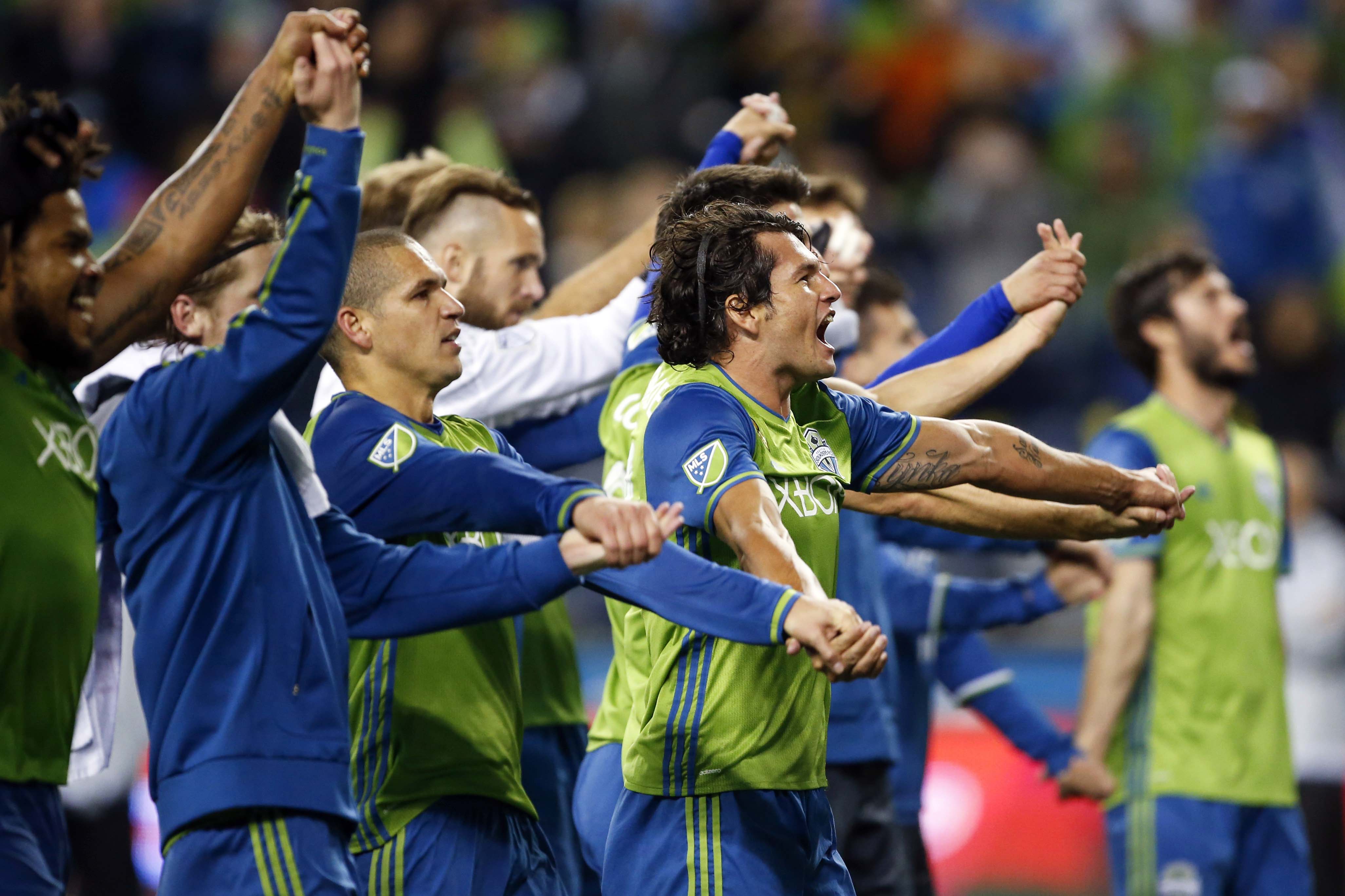 Oct 27, 2016; Seattle, WA, USA; Seattle Sounders FC forward Nelson Valdez (16) celebrates with his teammates after a 1-0 victory against Sporting Kansas City at CenturyLink Center. Mandatory Credit: Jennifer Buchanan-USA TODAY Sports