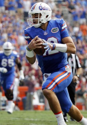 Nov 12, 2016; Gainesville, FL, USA; Florida Gators quarterback Austin Appleby (12) runs with the ball against the South Carolina Gamecocks during the first quarter at Ben Hill Griffin Stadium. Mandatory Credit: Kim Klement-USA TODAY Sports