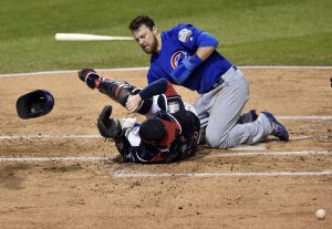 Nov 1, 2016; Cleveland, OH, USA; Chicago Cubs outfielder Ben Zobrist (18) scores a run past Cleveland Indians catcher Roberto Perez (55) in the first inning in game six of the 2016 World Series at Progressive Field. Mandatory Credit: David Richard-USA TODAY Sports