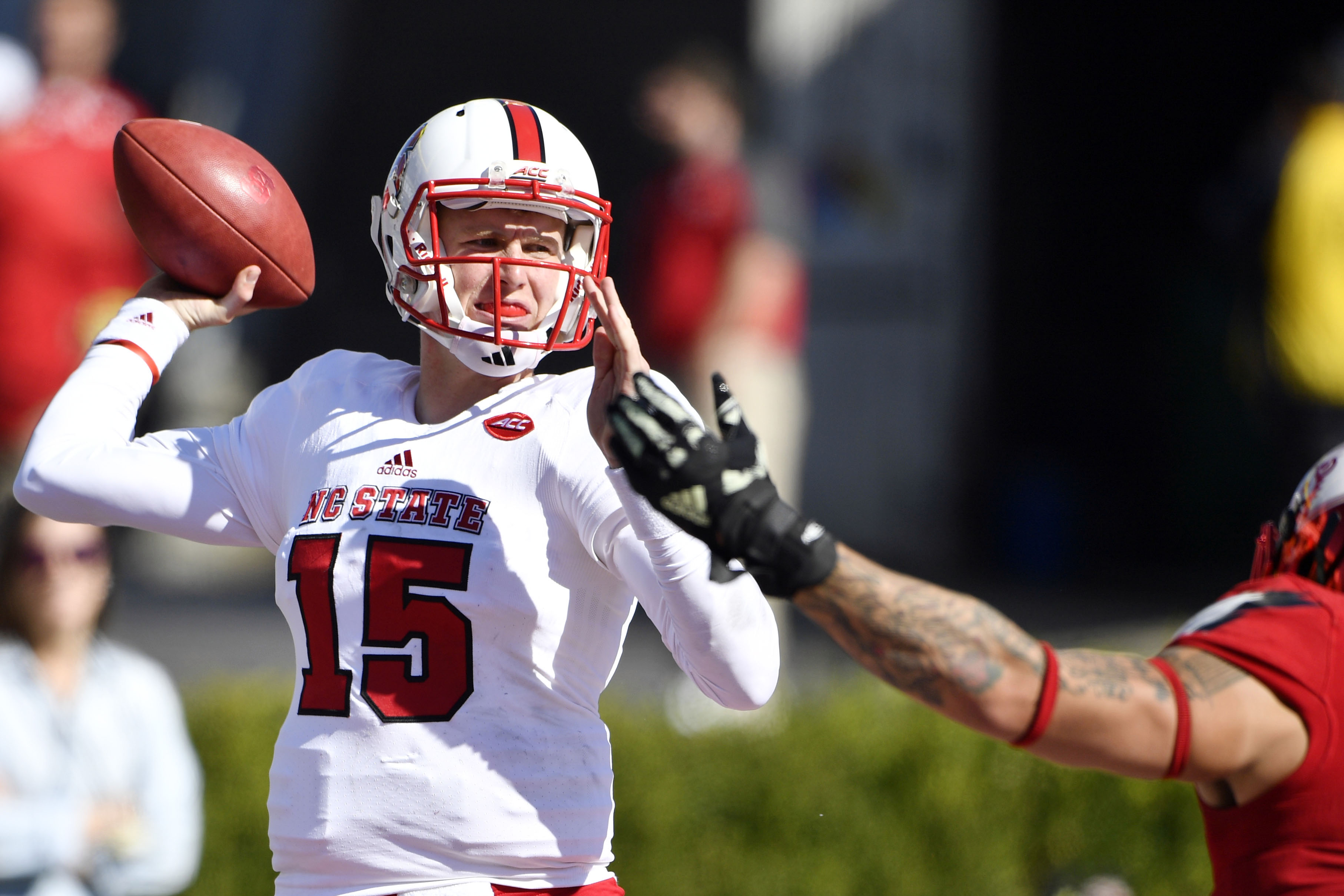 Oct 22, 2016; Louisville, KY, USA; North Carolina State Wolfpack quarterback Ryan Finley (15) looks to pass against the Louisville Cardinals during the second half at Papa John's Cardinal Stadium. Louisville defeated North Carolina State 54-13. Mandatory Credit: Jamie Rhodes-USA TODAY Sports