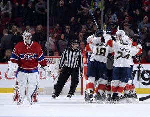 Nov 15, 2016; Montreal, Quebec, CAN; Florida Panthers defenseman Aaron Ekblad (5) reacts with teammates including Jussi Jokinen (36) after scoring the game winning a goal against Montreal Canadiens goalie Carey Price (31) during the overtime period at the Bell Centre. Mandatory Credit: Eric Bolte-USA TODAY Sports