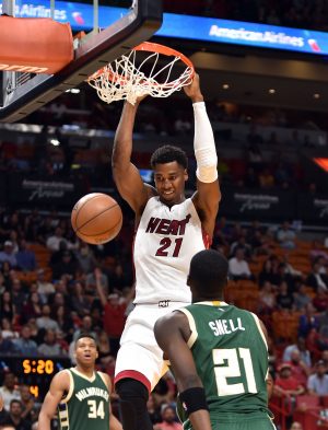 Nov 17, 2016; Miami, FL, USA; Miami Heat center Hassan Whiteside (21) dunks the ball against Milwaukee Bucks guard Tony Snell (21) during the second half at American Airlines Arena. The Heat won 96-73. Mandatory Credit: Steve Mitchell-USA TODAY Sports
