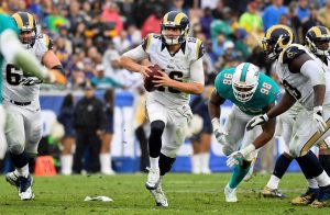 Caption: Nov 20, 2016; Los Angeles, CA, USA; Los Angeles Rams quarterback Jared Goff (16) scrambles against the Miami Dolphins during the second half of a NFL football game at Los Angeles Memorial Coliseum. Mandatory Credit: Kirby Lee-USA TODAY Sports