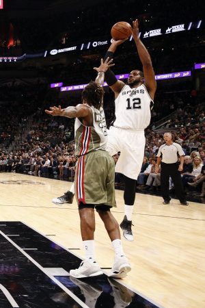 San Antonio Spurs power forward LaMarcus Aldridge (12) shoots the ball over Miami Heat power forward Derrick Williams (22). Mandatory Credit: Soobum Im-USA TODAY Sports