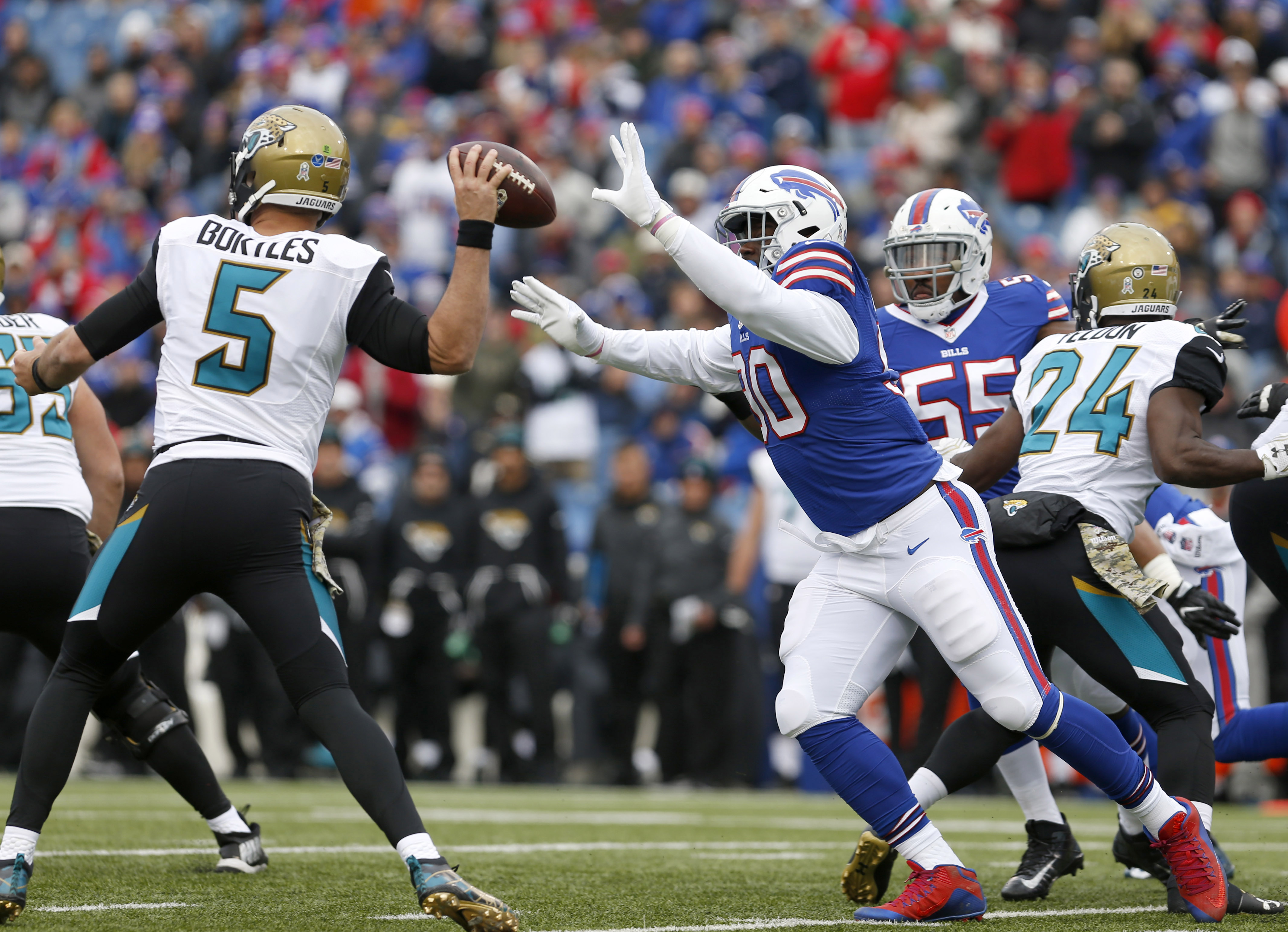 Nov 27, 2016; Orchard Park, NY, USA; Buffalo Bills defensive end Shaq Lawson (90) looks to knock the ball away from Jacksonville Jaguars quarterback Blake Bortles (5) during the first half at New Era Field. Mandatory Credit: Timothy T. Ludwig-USA TODAY Sports