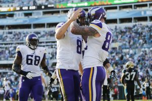Dec 11, 2016; Jacksonville, FL, USA; Minnesota Vikings tight end Kyle Rudolph (82) celebrates scoring a touchdown with quarterback Sam Bradford (8) in the second half against the Jacksonville Jaguars at EverBank Field. The Vikings won 25-16. Mandatory Credit: Logan Bowles-USA TODAY Sports